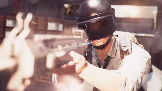 A man wearing a visor holding a large gun