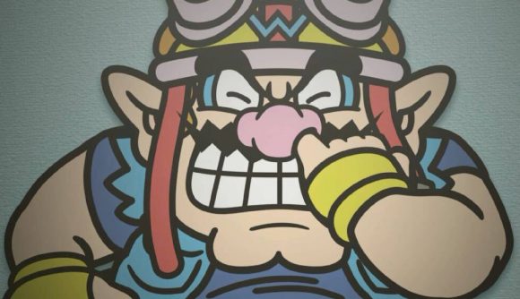 Wario painfully stabs a finger up his own nose
