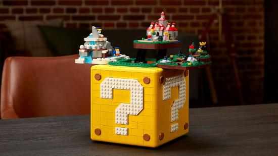 A large LEGO set shows a Question Block from Super Mario, opening up to reveal a diorama of Super Mario 64 levels
