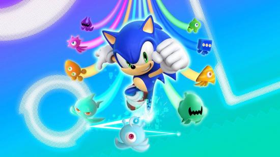Sonic jumps forward with his fist raised triumphantly, while the alien creatures Wisps zoom behind him