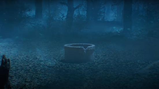 A well in the middle of a foggy forest