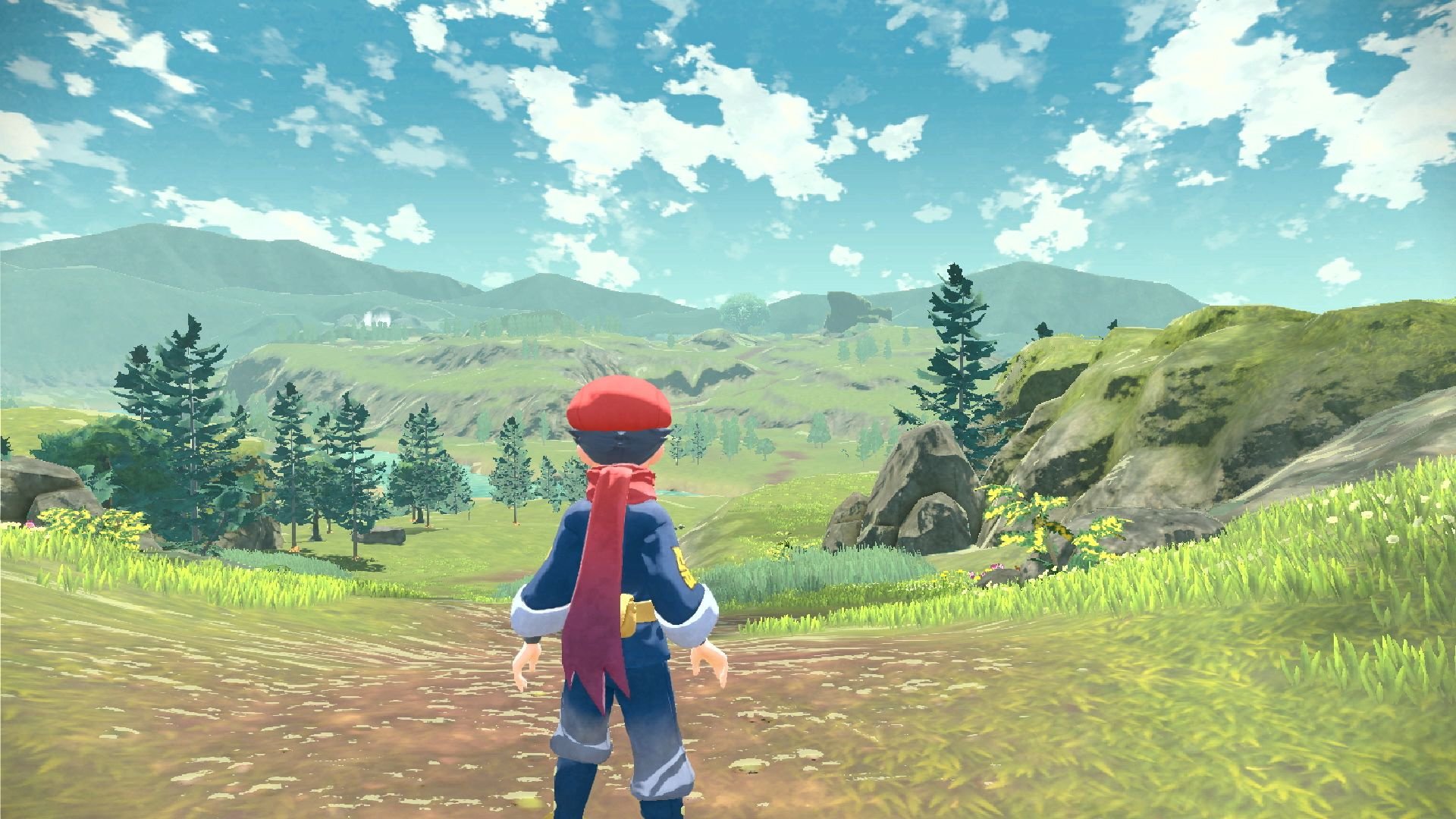Pokémon Switch games: Pokémon Legends Arceus. Image shows a trainer standing before the sprawling wilderness of ancient Sinnoh