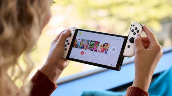 A picture of a woman attaching the right joy-con to a Nintendo Switch OLED model.