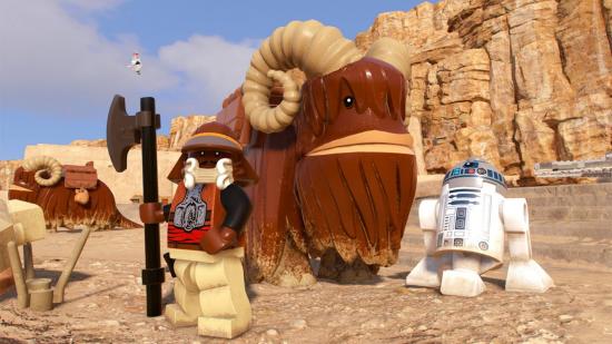 R2D2, a bantha, and a bantha rider, hanging out in the desert in Lego Star Wars: the Skywalker Saga.