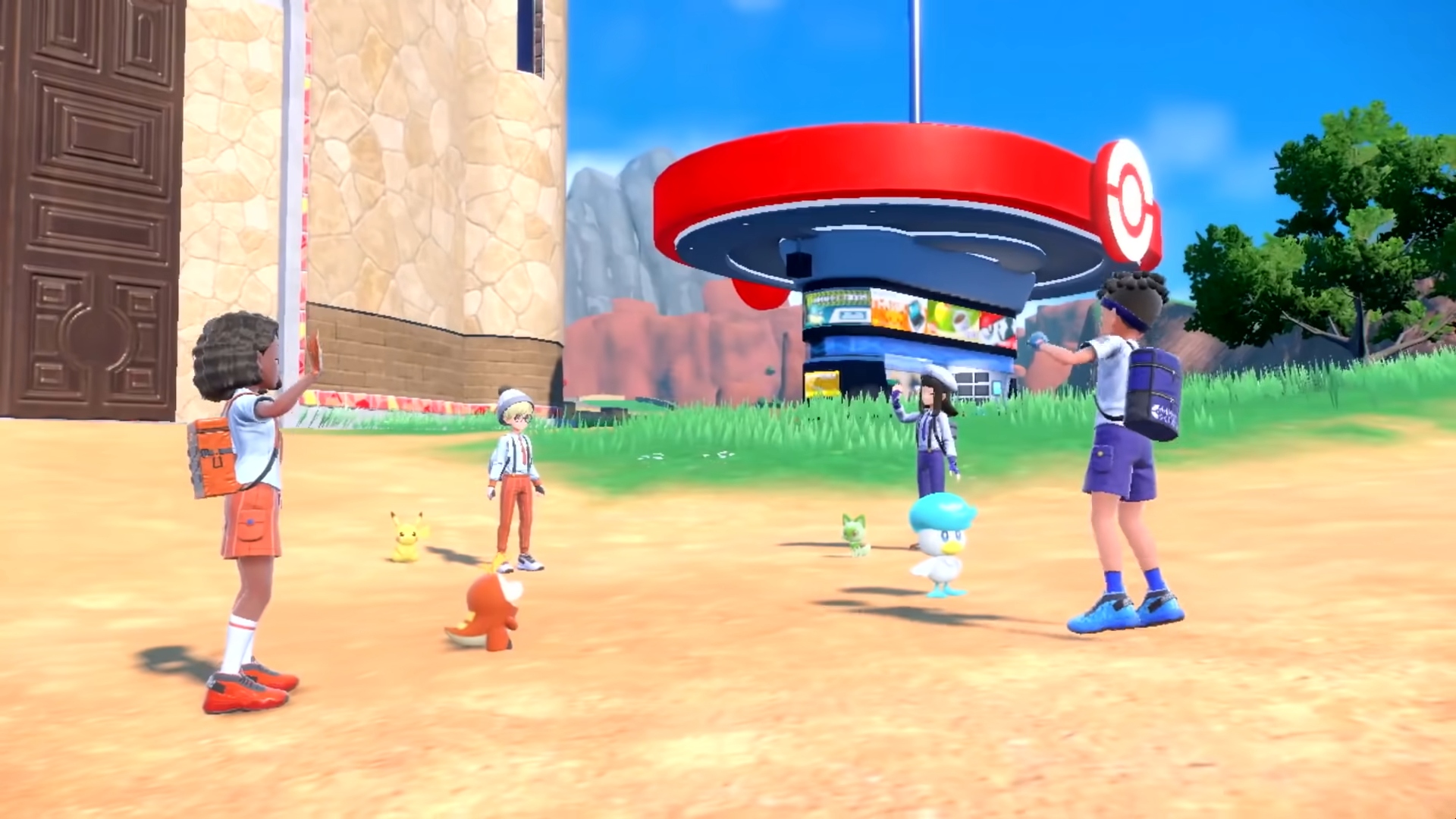 Pokémon Switch games - a scene from the Pokémon Scarlet and Violet trailer shows four trainers standing outside with their Pokémon.