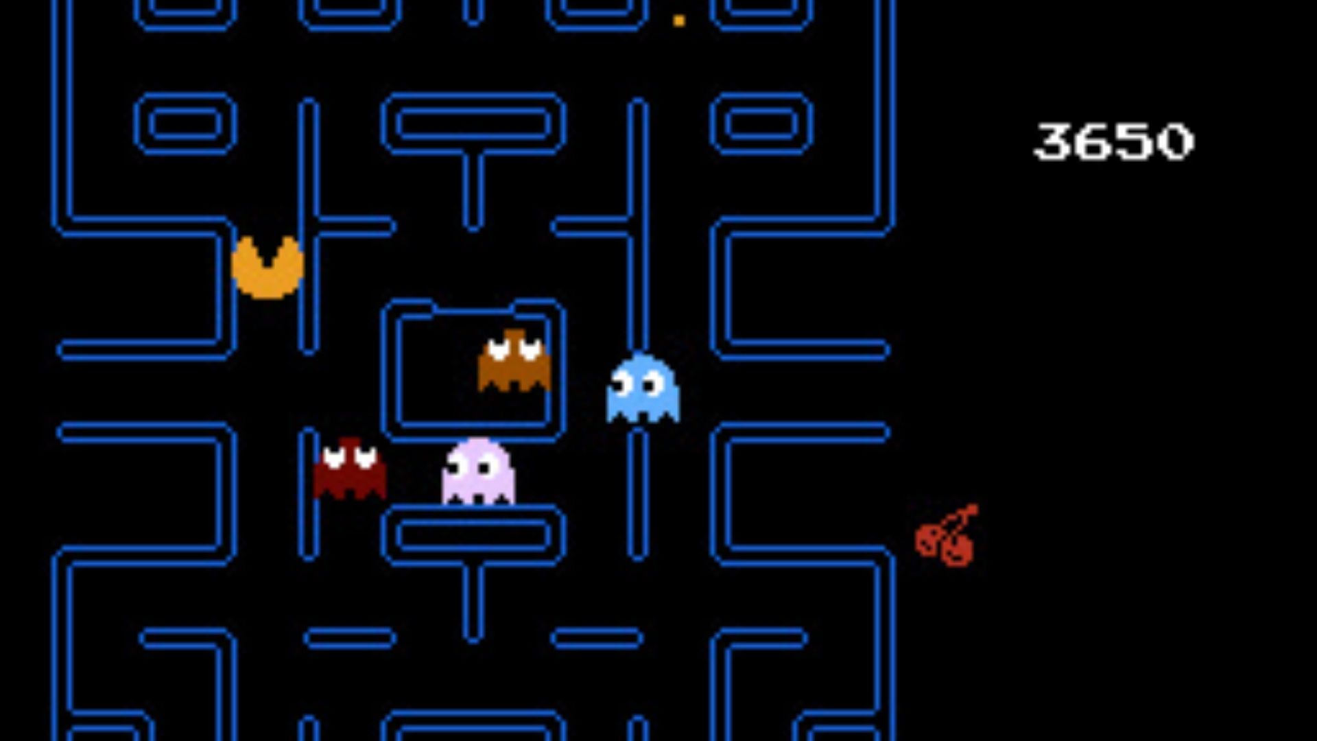 THe Pac-Man maze, with four 'ghosts', and the pac-man, mouth agape. The score is 3650. The player has collected one cherry.