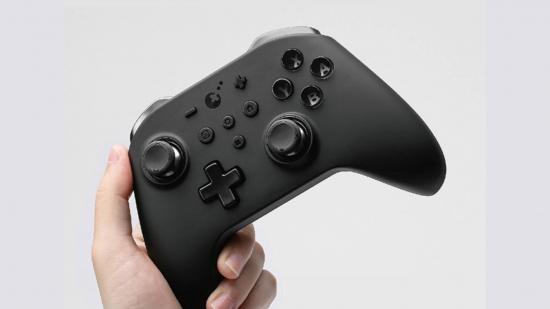 GuliKit King Kong Pro 2 controller: A product shot shows a sleek black controller against a white background