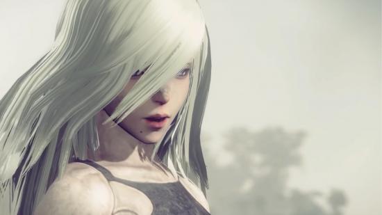 Nier Automata A2, close up, with long white hair over her face and a dusty sky in the background.