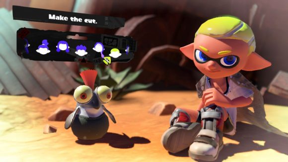 A short and slick Splatoon 3 hairstyle. Shown off by a character with grey shoes, yellow hair, sat in the desert with a cliff face behind them,and a small cute fish creature with an orange tuft of hair coming out the top of their head, and the menu options for choosing the hairstyle above.