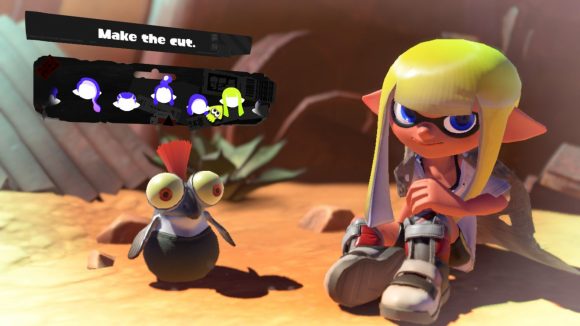 A long Splatoon 3 hairstyle. Shown off by a character with grey shoes, yellow hair, sat in the desert with a cliff face behind them,and a small cute fish creature with an orange tuft of hair coming out the top of their head, and the menu options for choosing the hairstyle above.