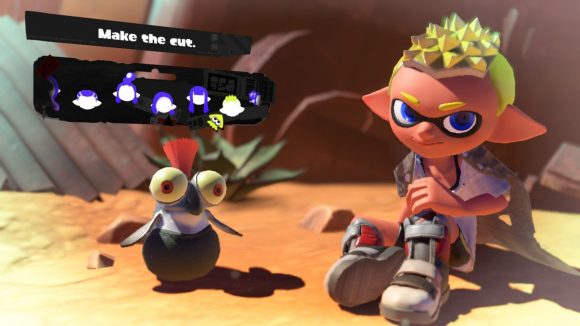 A tight and curly Splatoon 3 hairstyle. Shown off by a character with grey shoes, yellow hair, sat in the desert with a cliff face behind them,and a small cute fish creature with an orange tuft of hair coming out the top of their head, and the menu options for choosing the hairstyle above.