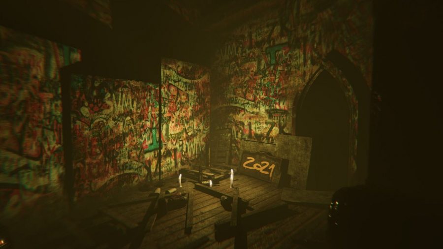 A dimly lit room covered in graffiti