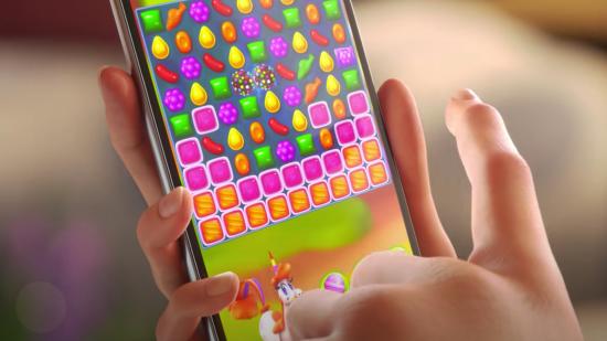 A phone playing a Candy Crush level
