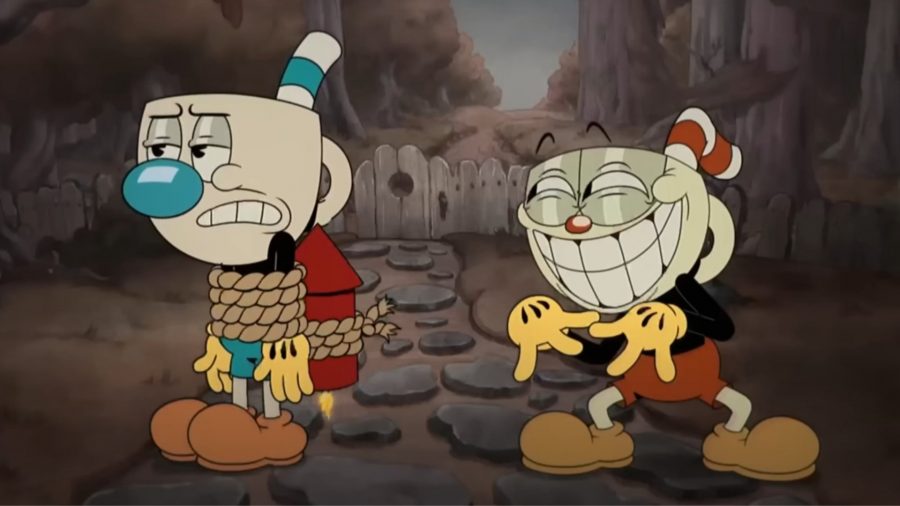 Cuphead Show - Cuphead sporting a huge grin as Mugman stands there tied to a rocket with a less than impressed look on his face