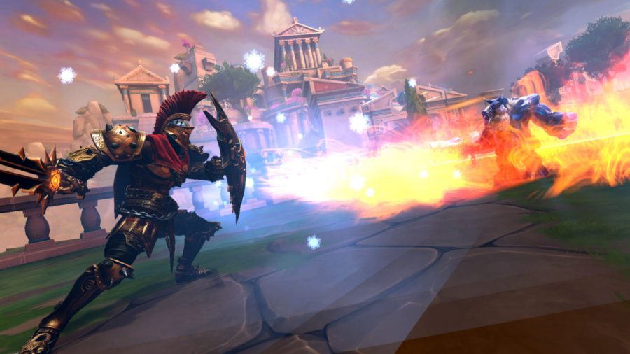 A Smite character equipped with sword and shield fends off a fiery attack