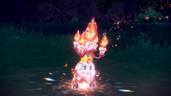 Pokemon Scarlet & Violet Terastal Pokemon: a screenshot shows the fire-dragon Pokemon Fuecoco encased in a crystal-like armour, with a chandalier sprouting out of its head