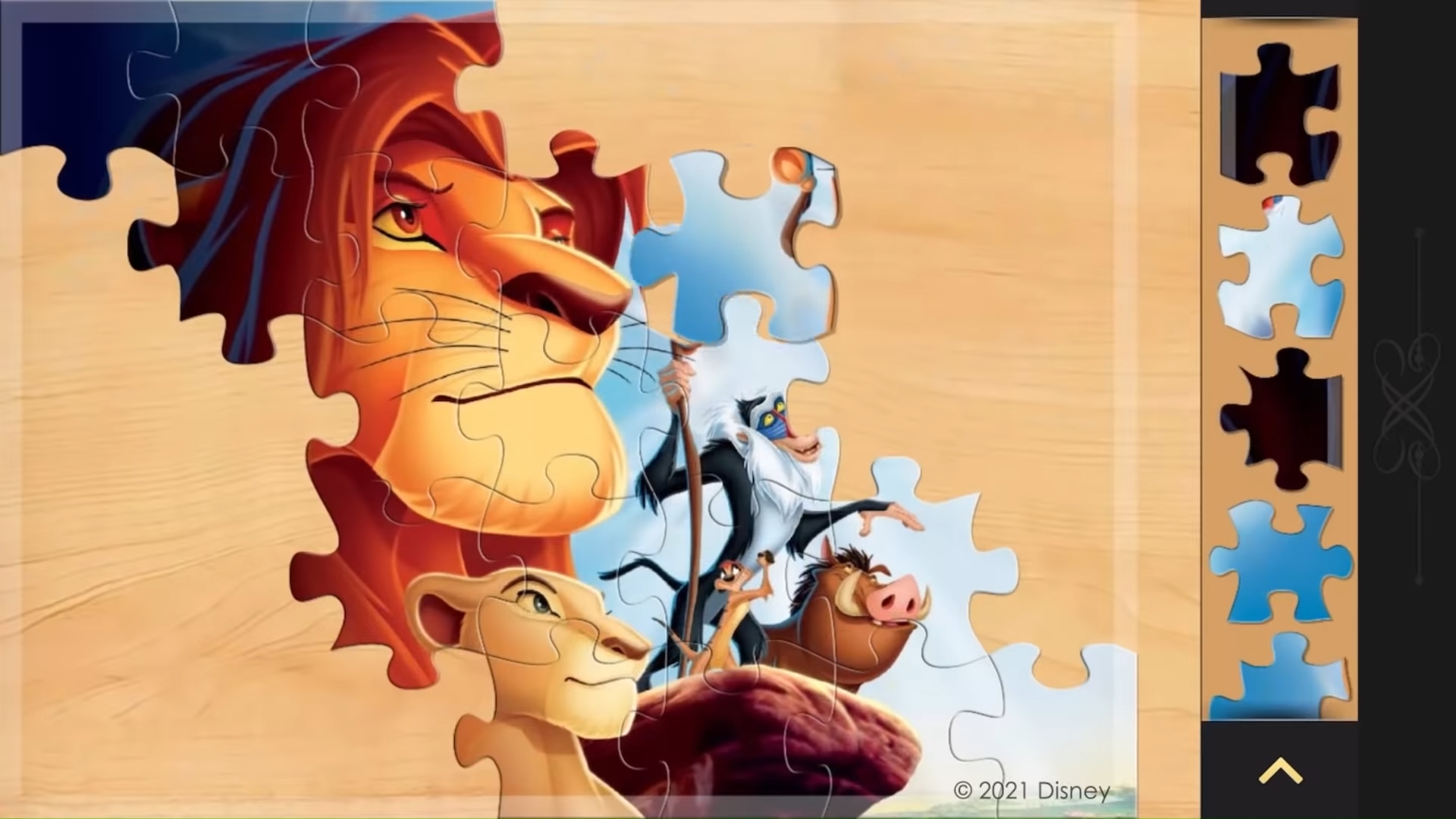 Addictive games: Magic Jigsaw Puzzles. Image shows a Lion King puzzle in progress.