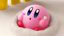 Kirby's Dream Buffet release date: Kirby appears in a pile of cream, looking up with adorable eyes