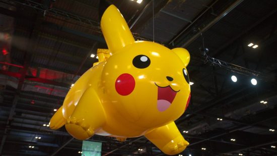 Pokemon Worlds 2022: a gigantic balloo pikachu floats just below the ceiling of a large room