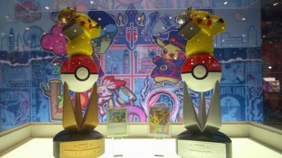Pokemon Worlds 2022: a glass cabinet contains two trophies for Pokemon Worlds 2022, both featuring Pikachu 