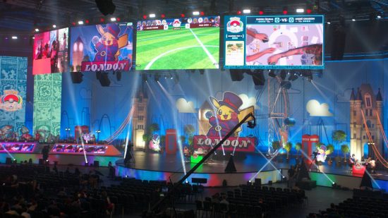 Pokemon Worlds 2022: a large stage shows several Pokemon battles happening, as well as screens displaying the matches