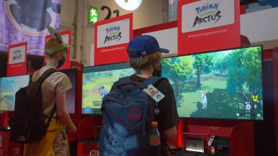 Pokemon Worlds 2022: a young gamer wearing a Pokemon backpack plays a demo unit of Pokemon Legends: Arceus