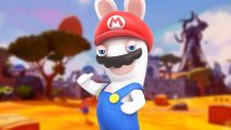 A rabbid (sort of a rabbit but a humanoid) wearing blue dungarees and a red hat to look like Mario, stood in front of a blurred desert landscape.