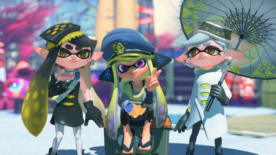 A screenshot from Splatoon 3 showing three characters, Callie, Marie, and Agent 2. They are squid-like human-shaped people. The two on either side are stood up, one wearing black with black hair, the other wearing white with white hair and a white parasol. The one in the middle has a captain's hat on, long squidgy tentacle-hair, and is doing a peace sign with her fingers.