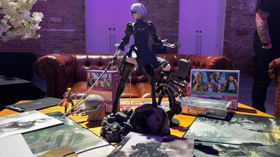A huge Nier Automata 2B statue in the middle of a table