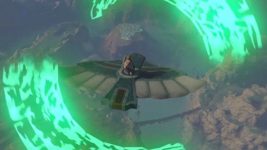 A screenshot from The Legend of Zelda: Tears of the Kingdom shows Link riding on the back of a large mechanical bird over the land of Hyrule