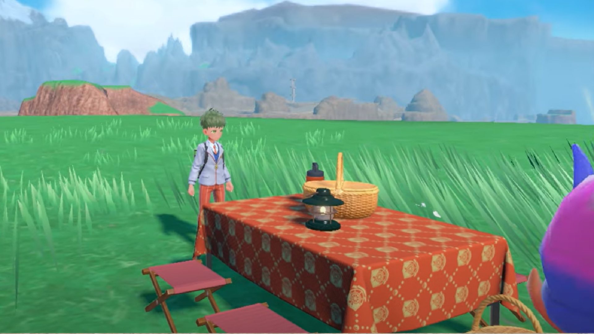 Pokemon Scarlet and VIolet picnics: a trainer looks at a picnic table
