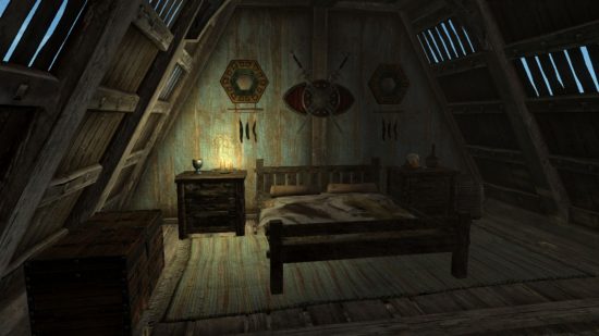 Skyrim marriage: a dark room lit by a single candle with a bed, sidetable, and various ornaments on the wall. Everything is very fantastically medieval.
