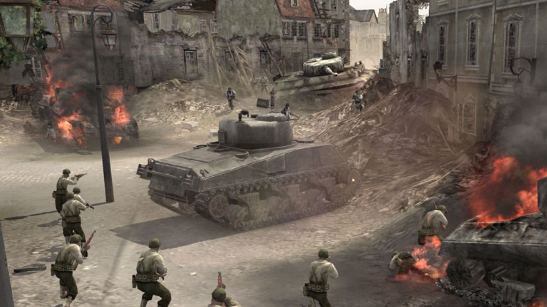 Best history games: Company of Heroes. Image shows a group of soldiers approaching a tank.