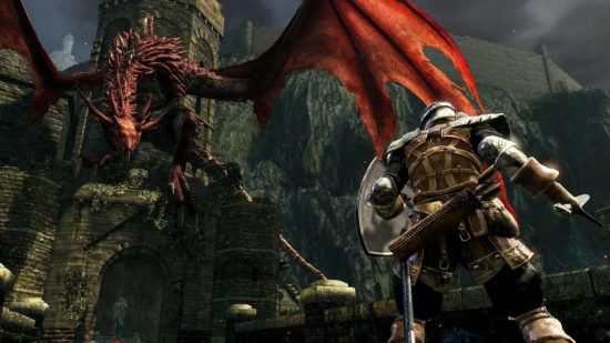 A Dark Souls knight faces up to a giant red wyvern on a battlement at the end of a stone bridge.