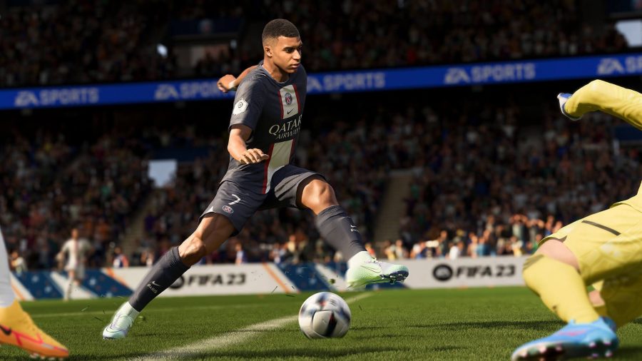 Fifa 23 hero image showing Kylian Mbappe playing football, stepping one foot over a ball with a crowd in the stands behind him. He has short shaved hair and a PSG kit on.