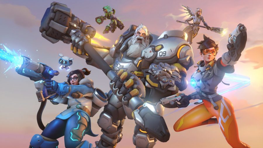 Various Overwatch 2 characters in some art for the game. On the right is Tracer, a woman in tight orange trousers, wielding two guns. In the middle is a giant man with a large hammer and massive silver armour. On the left is a smaller woman with an ice gun.