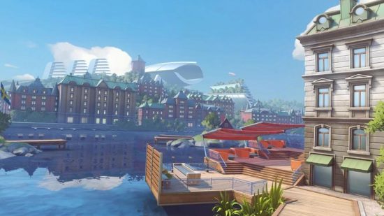 מפה של Overwatch 2 המציגה סצנה המציגה מפרץ בגטבורג, עם ארכיטקטורת סקנדי ושבילי לבנים