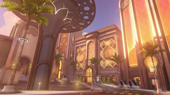 An Overwatch 2 map showing a scene a gold-lit square with a tree-like sculpture in the middle.