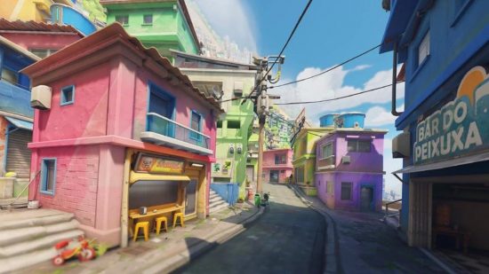 An Overwatch 2 map showing a scene showing colourful buildings on a tight street in Rio de Janeiro.