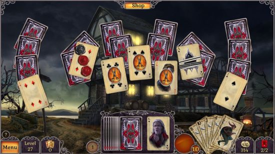 One of the many ways to play Solitaire on Switch and mobile, Jewel Match Twilight Solitaire, showing various spooky cards on a background of a haunted house.