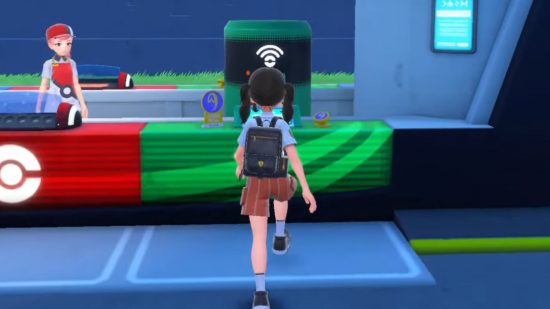 A player walking towards a Pokémon Scarlet and Violet tm machine in a Pokemon centre
