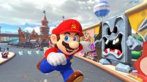 Mario Kart Tour Berlin Byway: Mario runs through the streets of Berlin, with a hammer and sickle insignia on his iconic red hat