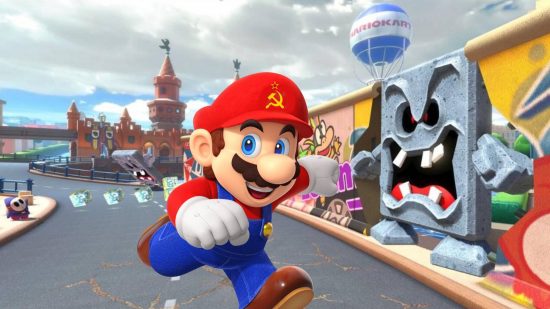 Mario Kart Tour Berlin Byway: Mario runs through the streets of Berlin, with a hammer and sickle insignia on his iconic red hat