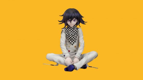 A Danganronpa figure on a yellow background. It's a boy sat cross legged, arms on his ankles, in a sort of chef outfit with a black and white neckerchief and long wild black hair.