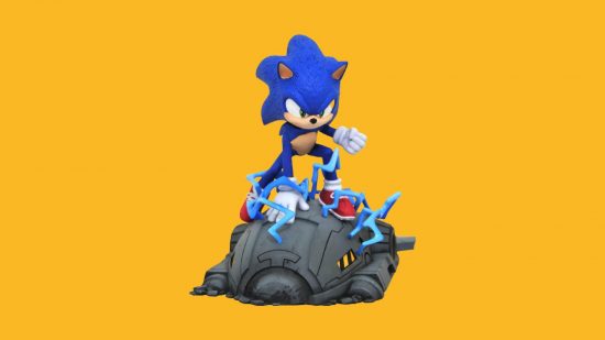 Sonic figures: Sonic is a blue hedgehog, with red shoes and white gloves. Here, he is kneeling on a crashed spaceship.