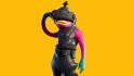 Fortnite Fishstick, an orange fish humanod with one arm raised against its head. This version has a black vr headset on and a black rubber outfit.
