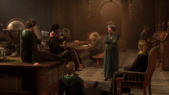 Hogwarts Legacy classes - a bunch of students speaking to a teacher in a classroom