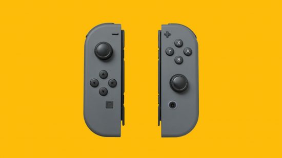 Nintendo Switch Joy-Con drift - a pair of Joy-Con controllers, both grey, floating on a mango-yellow background. They are about the size of a Mars Bar, with rounded edges on their outsides, flat edges on the inside with a little mechanism to attach to the console. They have opposite analogue sticks and four face buttons on each.
