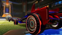 Rocket League cars chasing a ball on the pitch