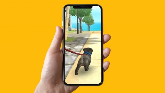Nintendogs'mobile'game: an image shows a hand holding an iphone aloft, with Nintendogs appearing on the screen